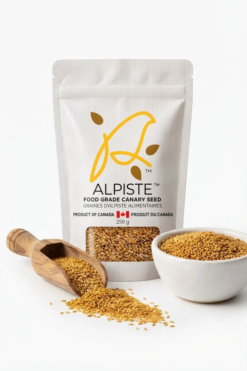 Annanda Alpiste Food Grade Canary Seeds with wooden spoon and bowl of alpiste seeds